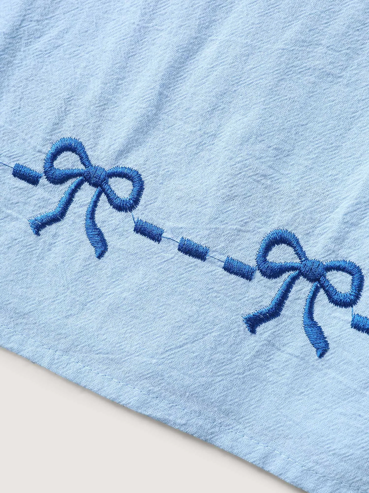 Bow-tiful Embroidery Ruched Neck Blouse sold by Bloomchic product image thumbnail 5