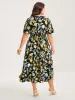 Citrus Print Overlap Neck Shirred Midi Dress sold by Bloomchic
