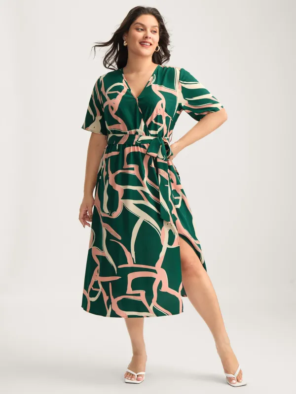 Abstract Belted Side Slit Surplice Midi Dress sold by Bloomchic