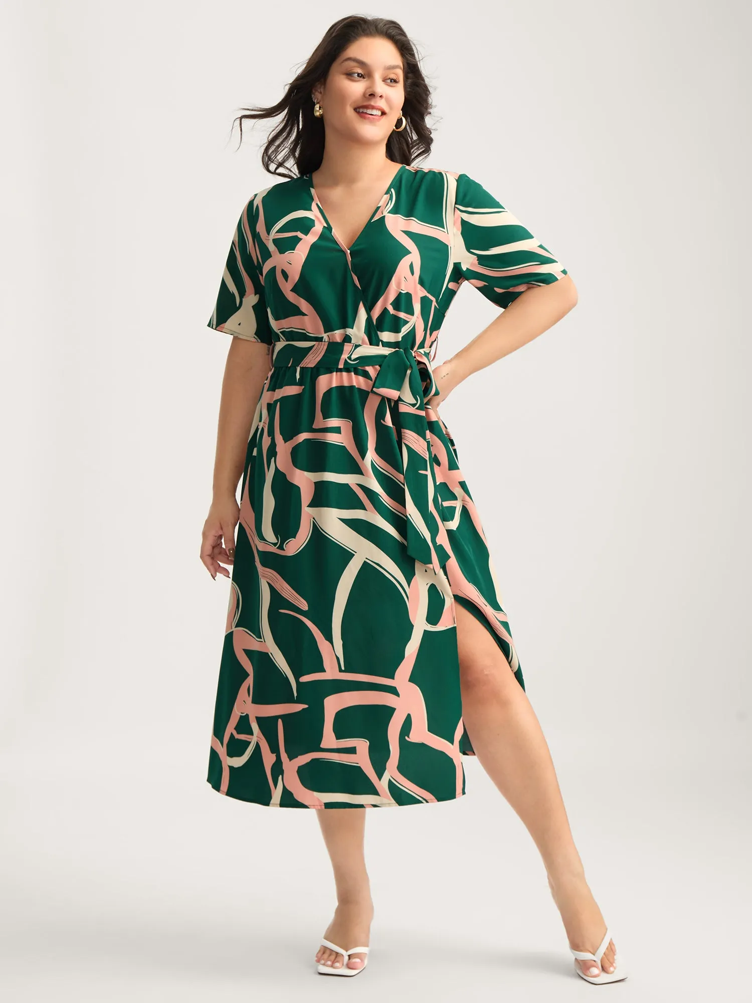 Abstract Belted Side Slit Surplice Midi Dress sold by Bloomchic