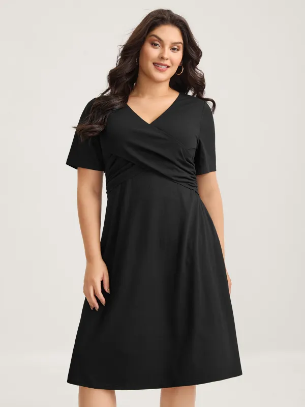 Overlap Bodice Solid Knit Pockets Midi Dress sold by Bloomchic