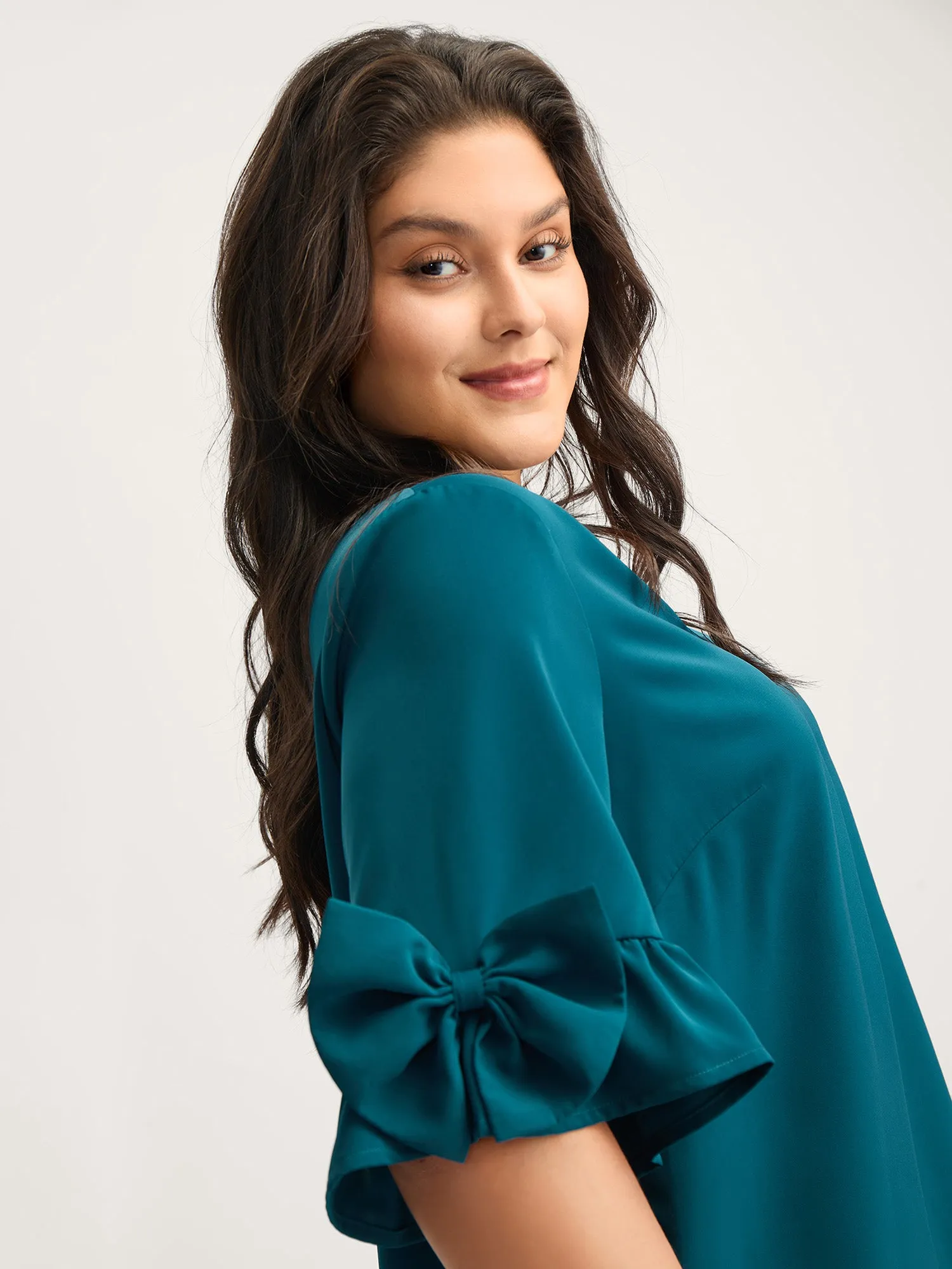 Ruffled 3D Bow Detail Solid Blouse sold by Bloomchic