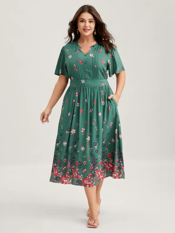 Floral Pleated Notched Collar Midi Dress sold by Bloomchic