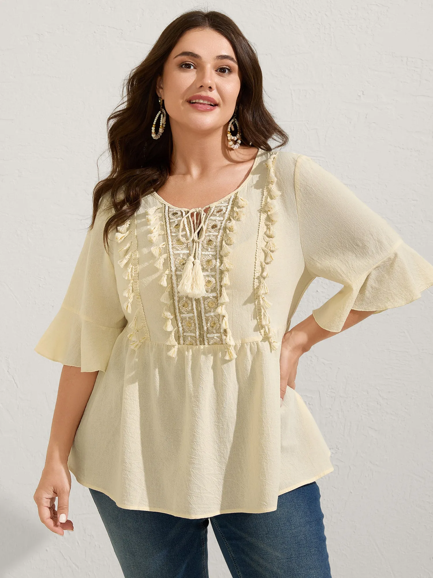 Cotton Tassel Neckline Ruffled Sleeve Solid Top sold by Bloomchic