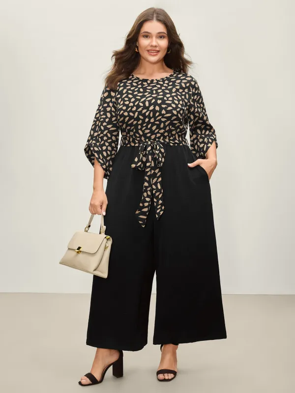 Asymmetrical Hearts Belted Waist Jumpsuit sold by Bloomchic