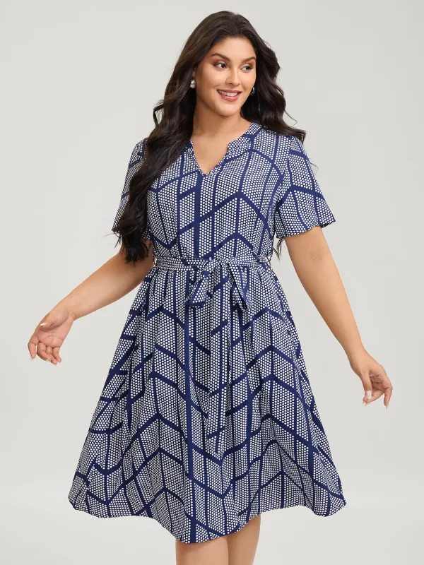 Geometrical Print Notched Collar Belted Midi Dress sold by Bloomchic