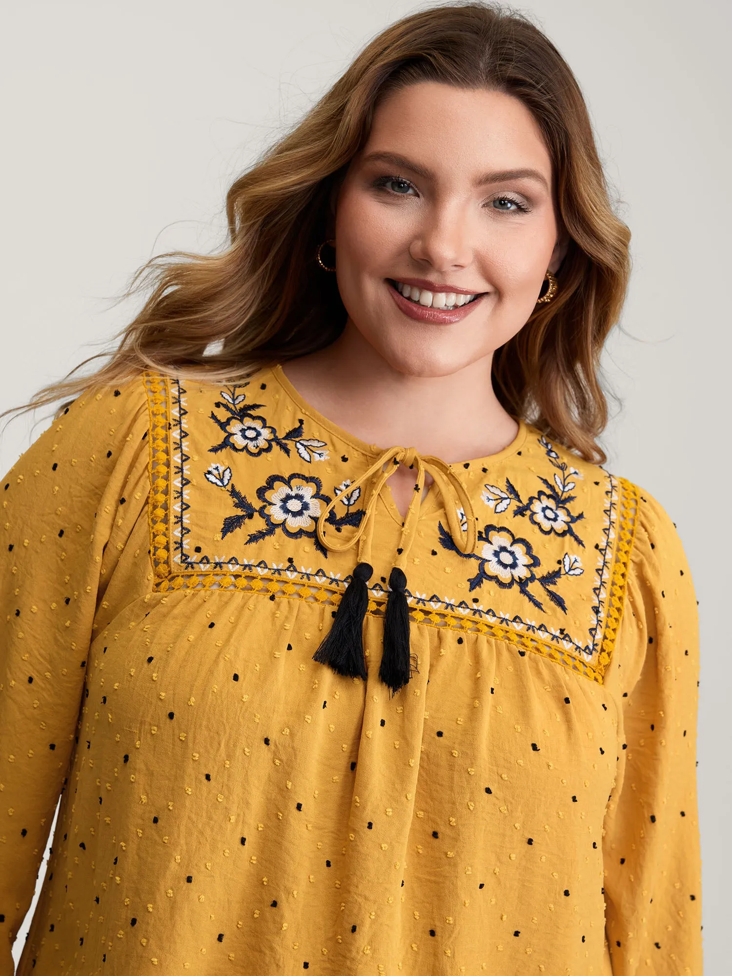 Textured Dot Embroidered Tassel Flowy Blouse sold by Bloomchic
