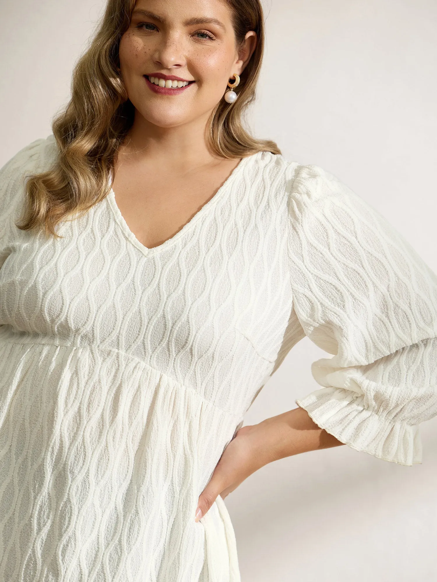 Textured Puffy Sleeve V-Neck Blouse sold by Bloomchic product image thumbnail 2