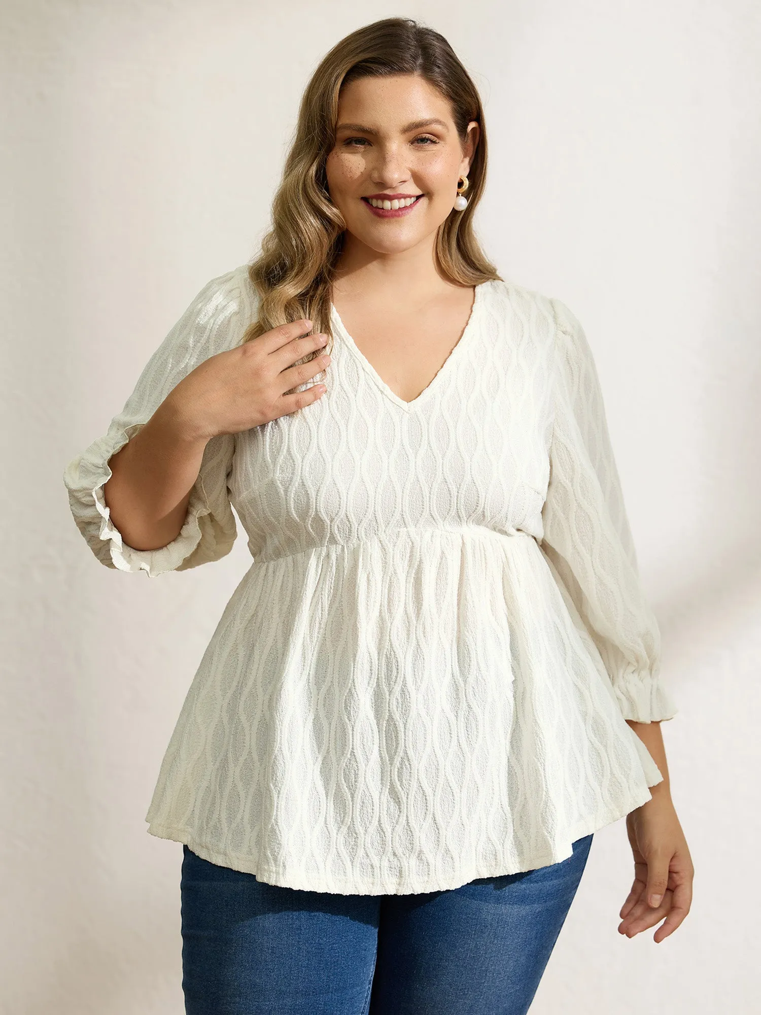 Textured Puffy Sleeve V-Neck Blouse sold by Bloomchic