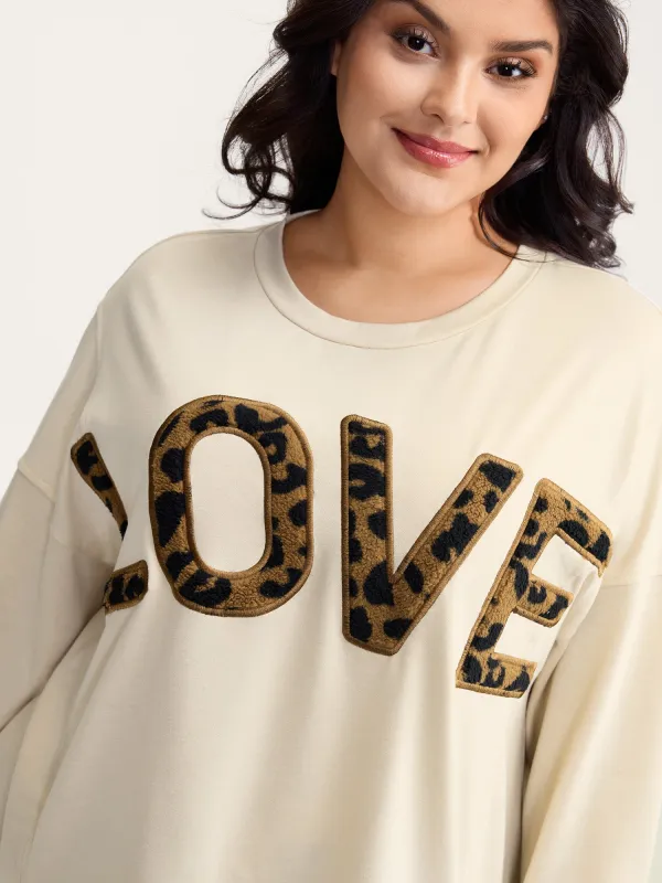 Wild Love Print Slit Hem Sweatshirt sold by Bloomchic