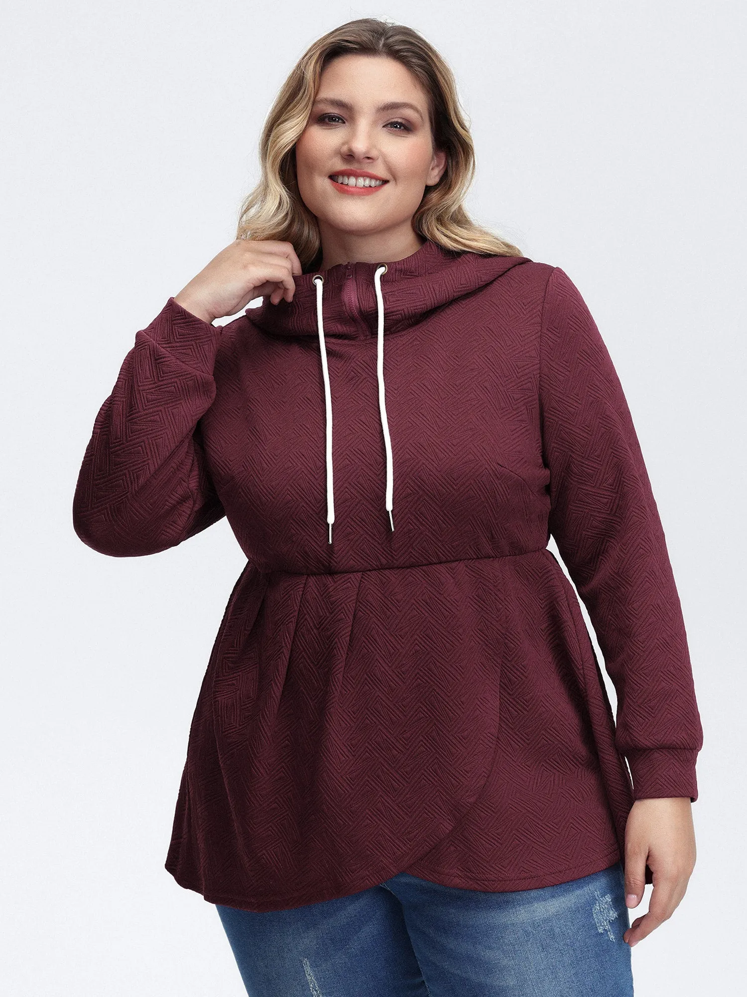 Textured Drawstring Overlap Hem Hooded Sweatshirt sold by Bloomchic