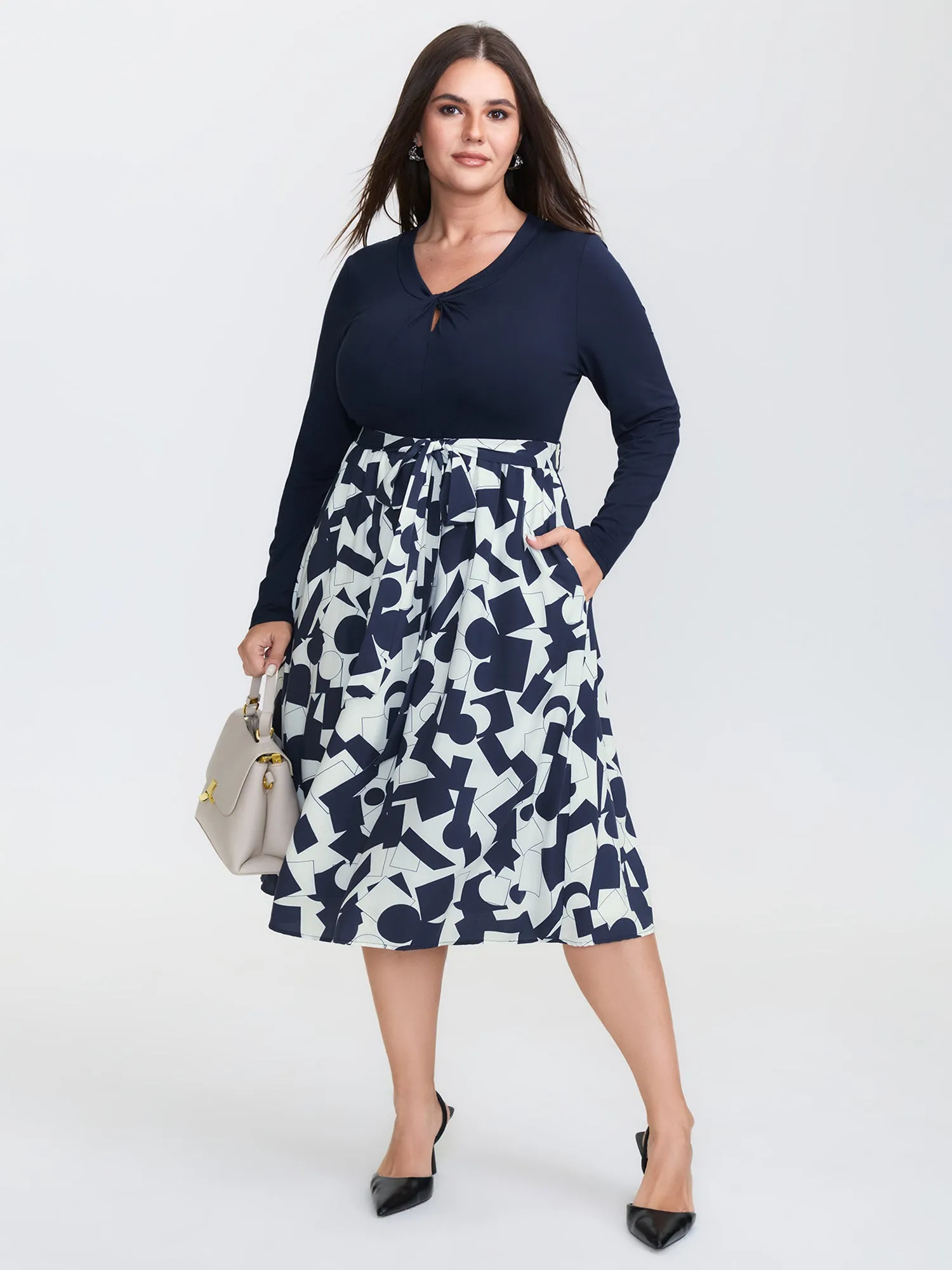 Supersoft Twist Neckline Floral Knit Midi Dress sold by Bloomchic