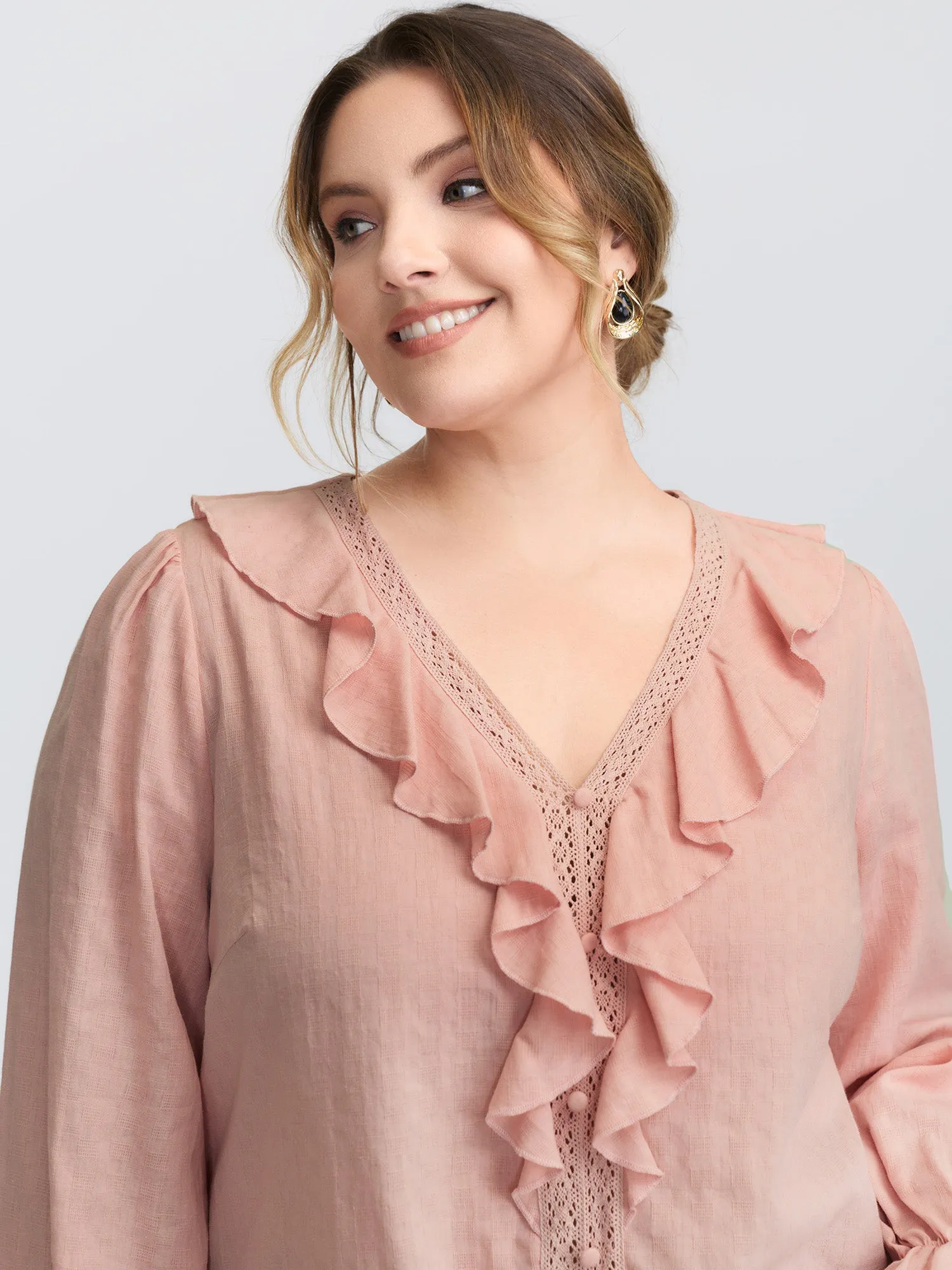 Textured Ruffled V-Neck Blouse sold by Bloomchic