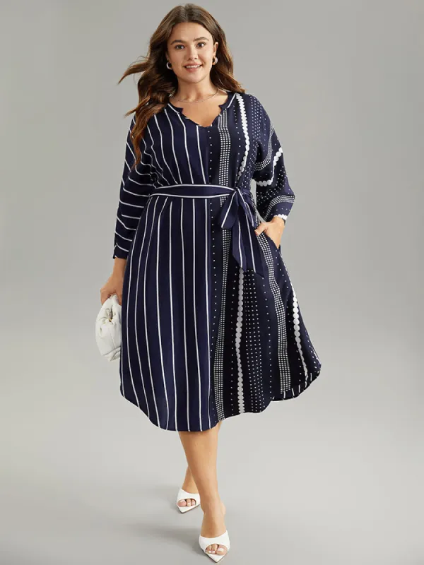 Striped Patchwork Polka Dot Belted Notched Dress sold by Bloomchic
