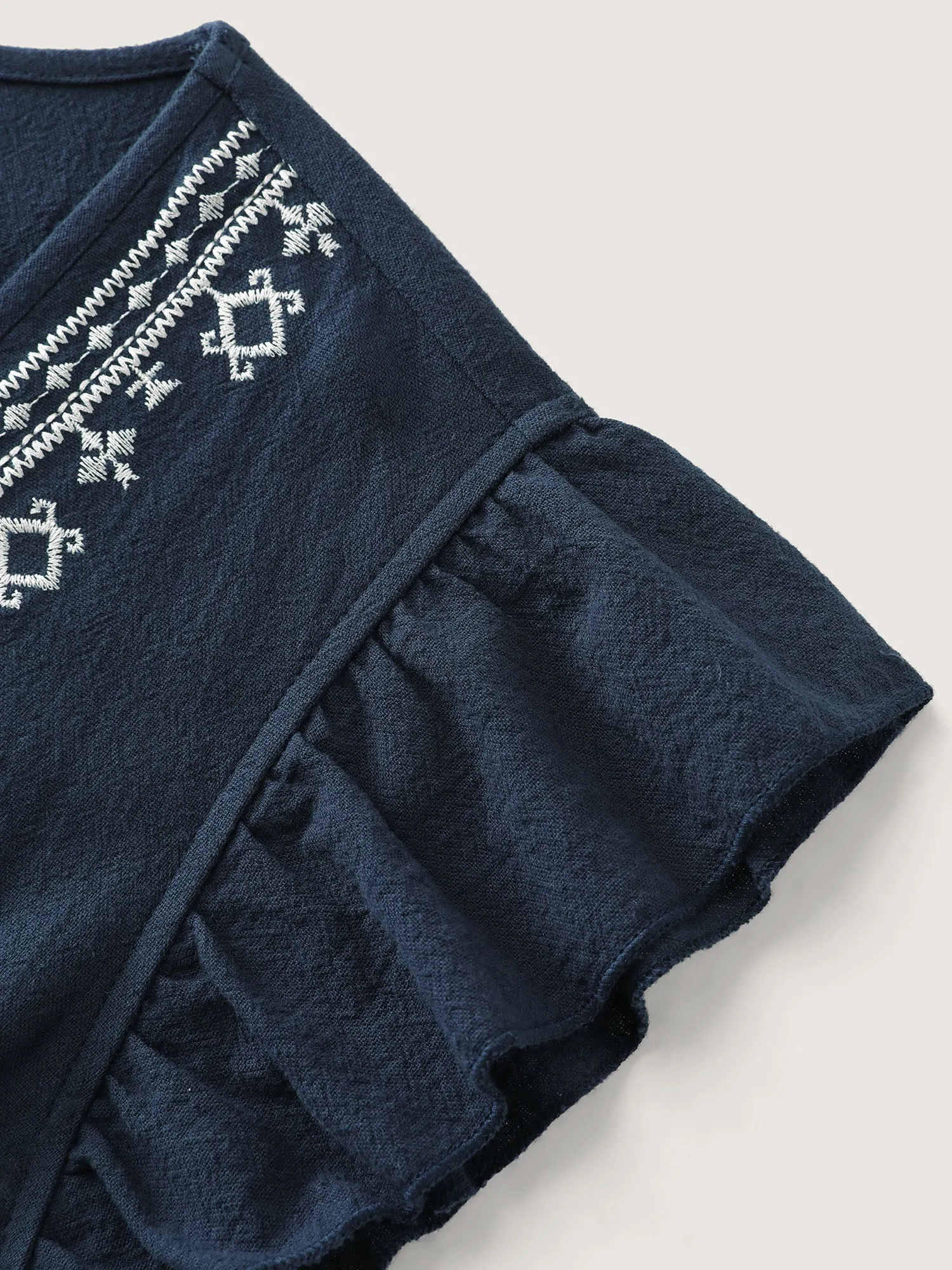 Cotton Embroidered Flutter Sleeve High-Low Hem Blouse sold by Bloomchic product image thumbnail 5