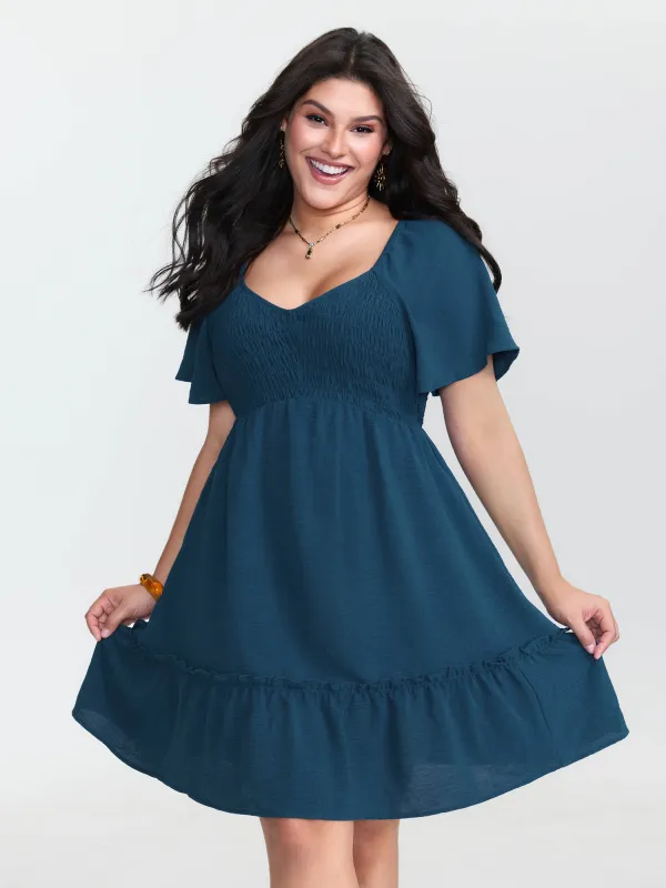 Shirred Bodice Ruffle Hem Flowy Mini Dress made by Bloomchic