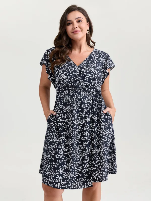 Rayon Floral Print Pleated Pockets Mini Dress made by Bloomchic