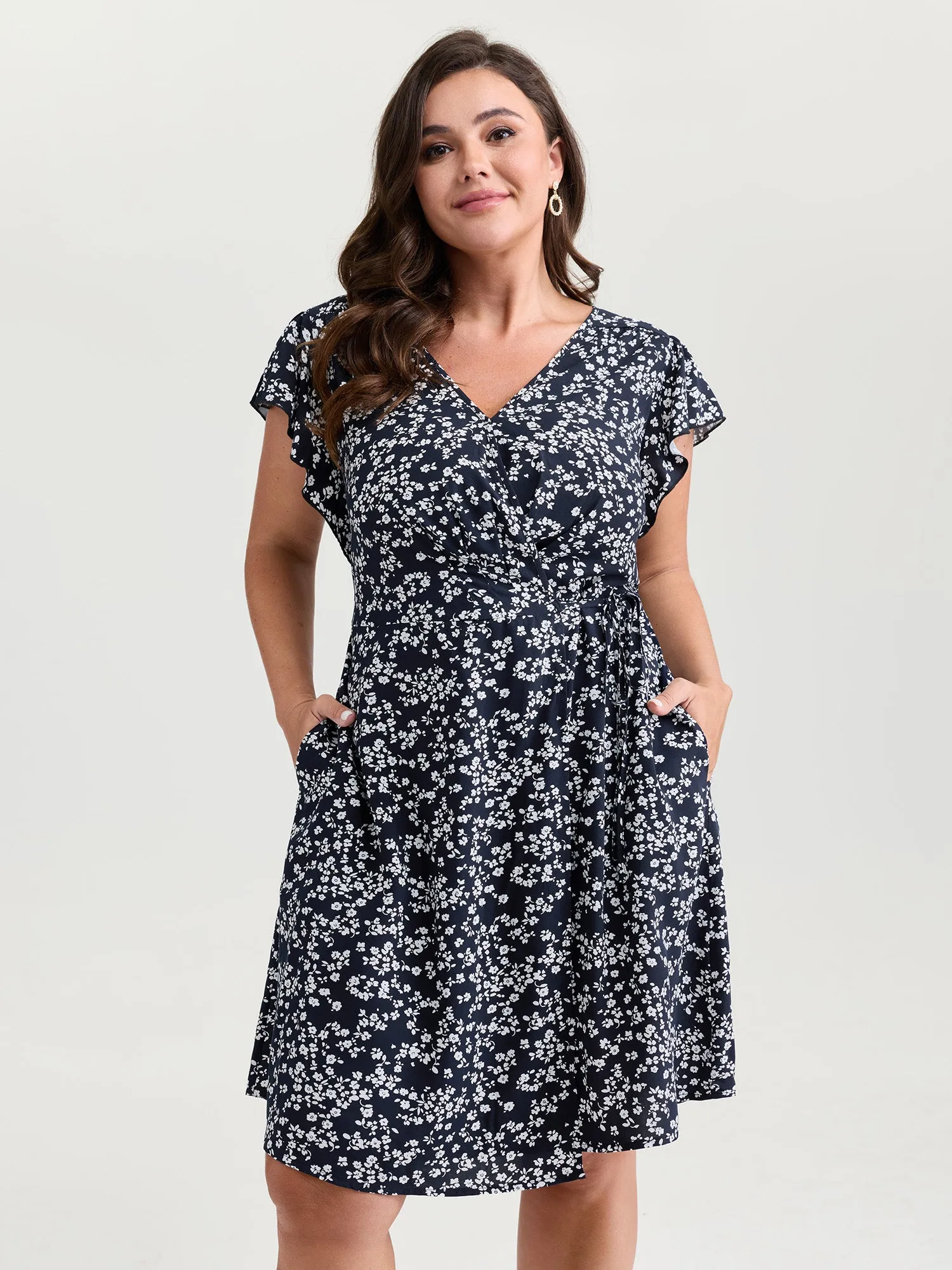 Rayon Floral Print Pleated Pockets Mini Dress sold by Bloomchic