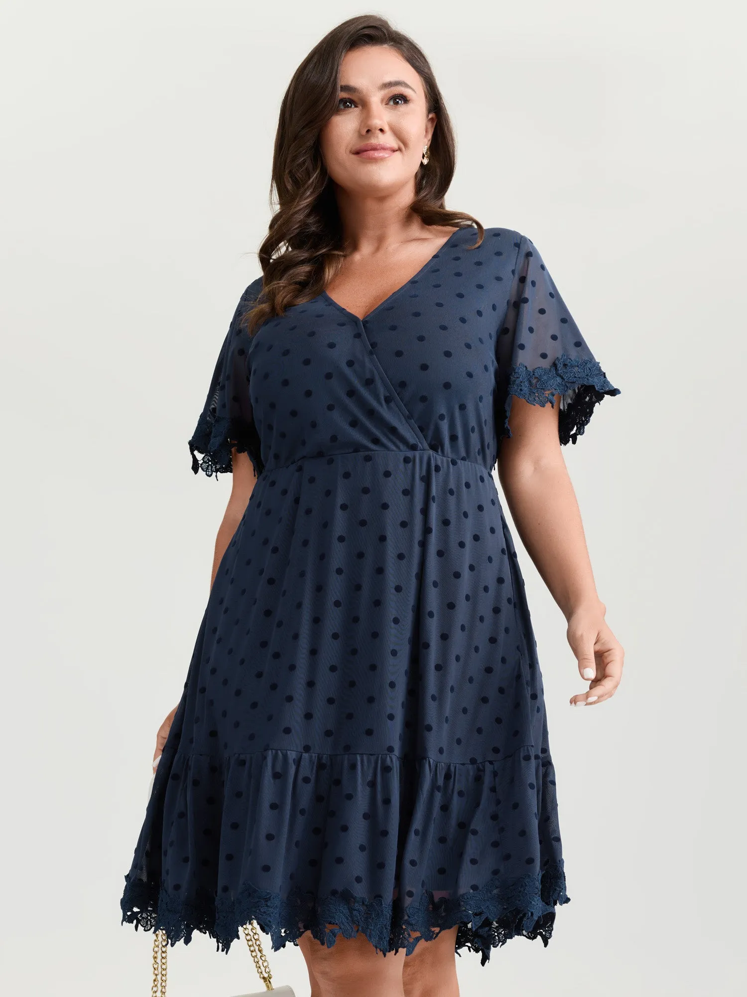 Polka Dot Textured Lace Trim Mini Dress sold by Bloomchic