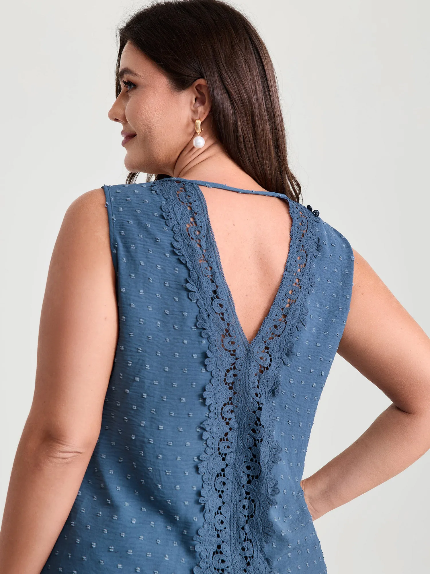 Cut-Out Textured Open Back Tank Top sold by Bloomchic