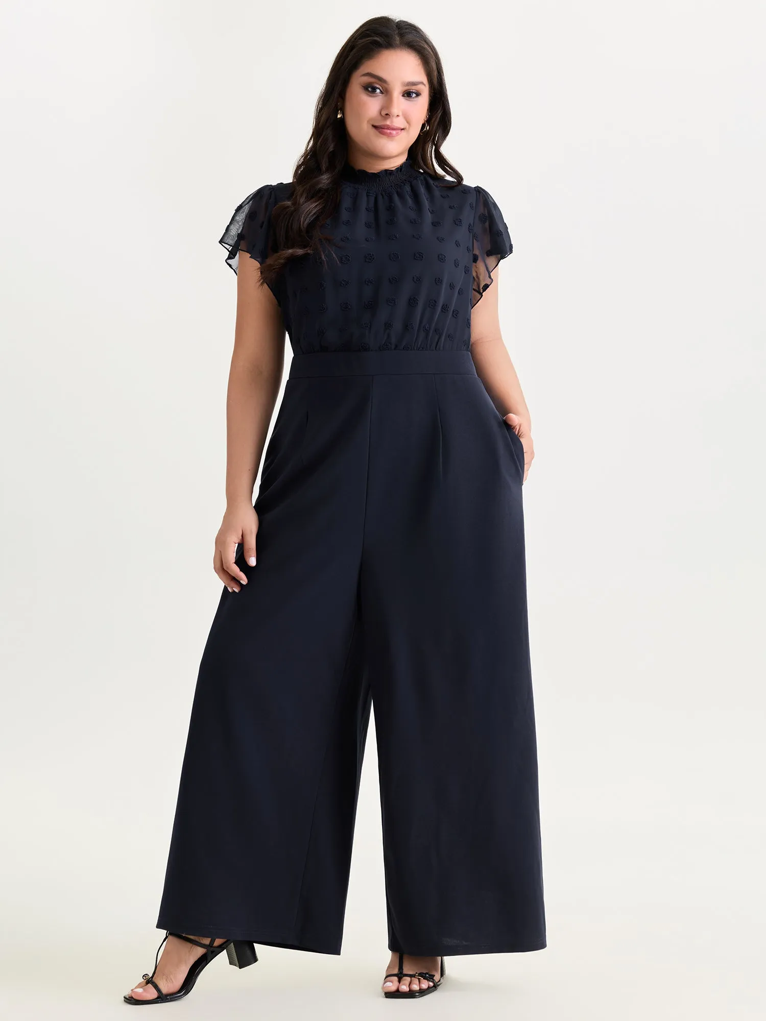 Textured Mock Neck Ruffled Sleeve Jumpsuit sold by Bloomchic