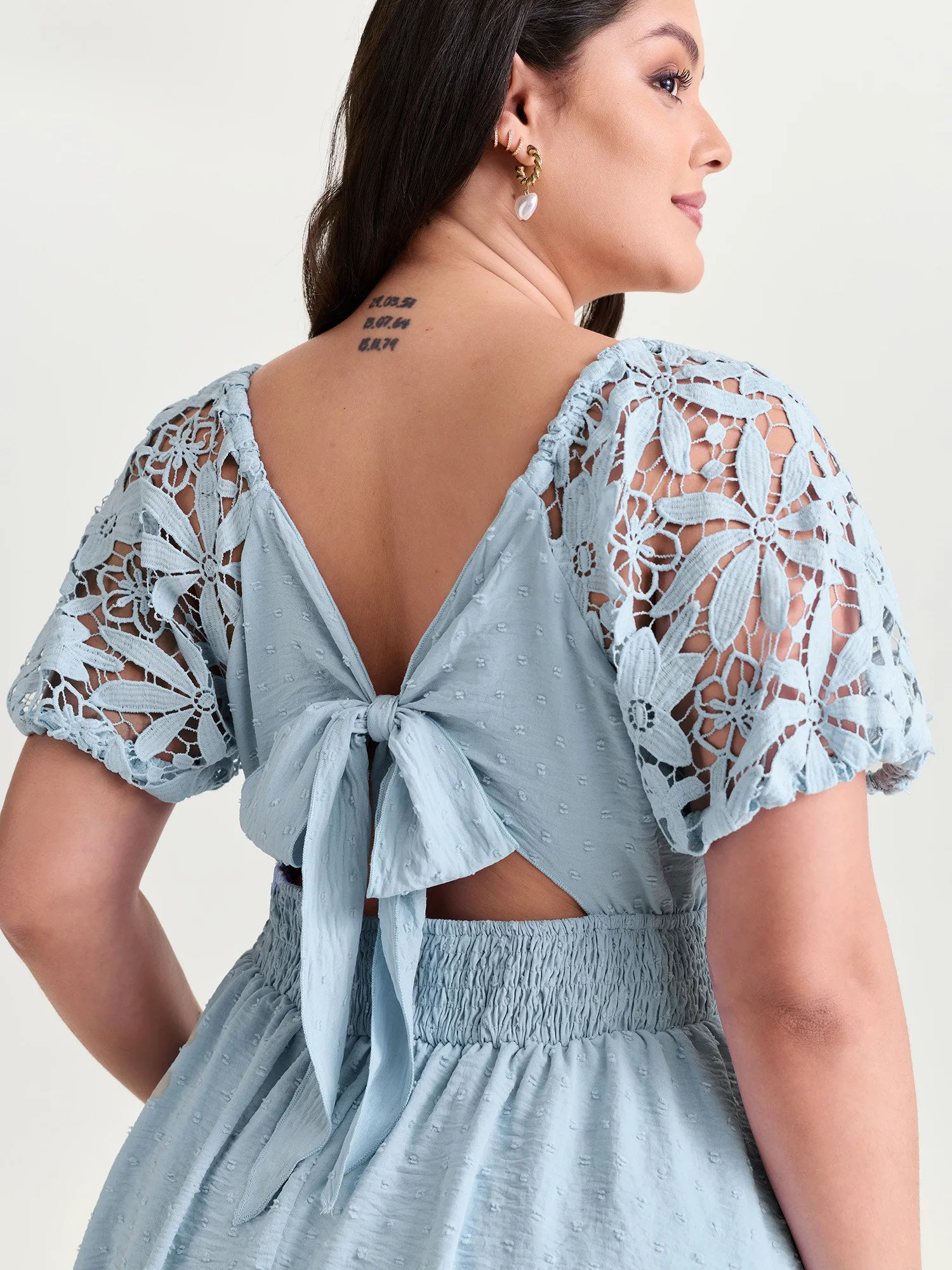 Sheer Lace Sleeve Open Back Mini Dress sold by Bloomchic
