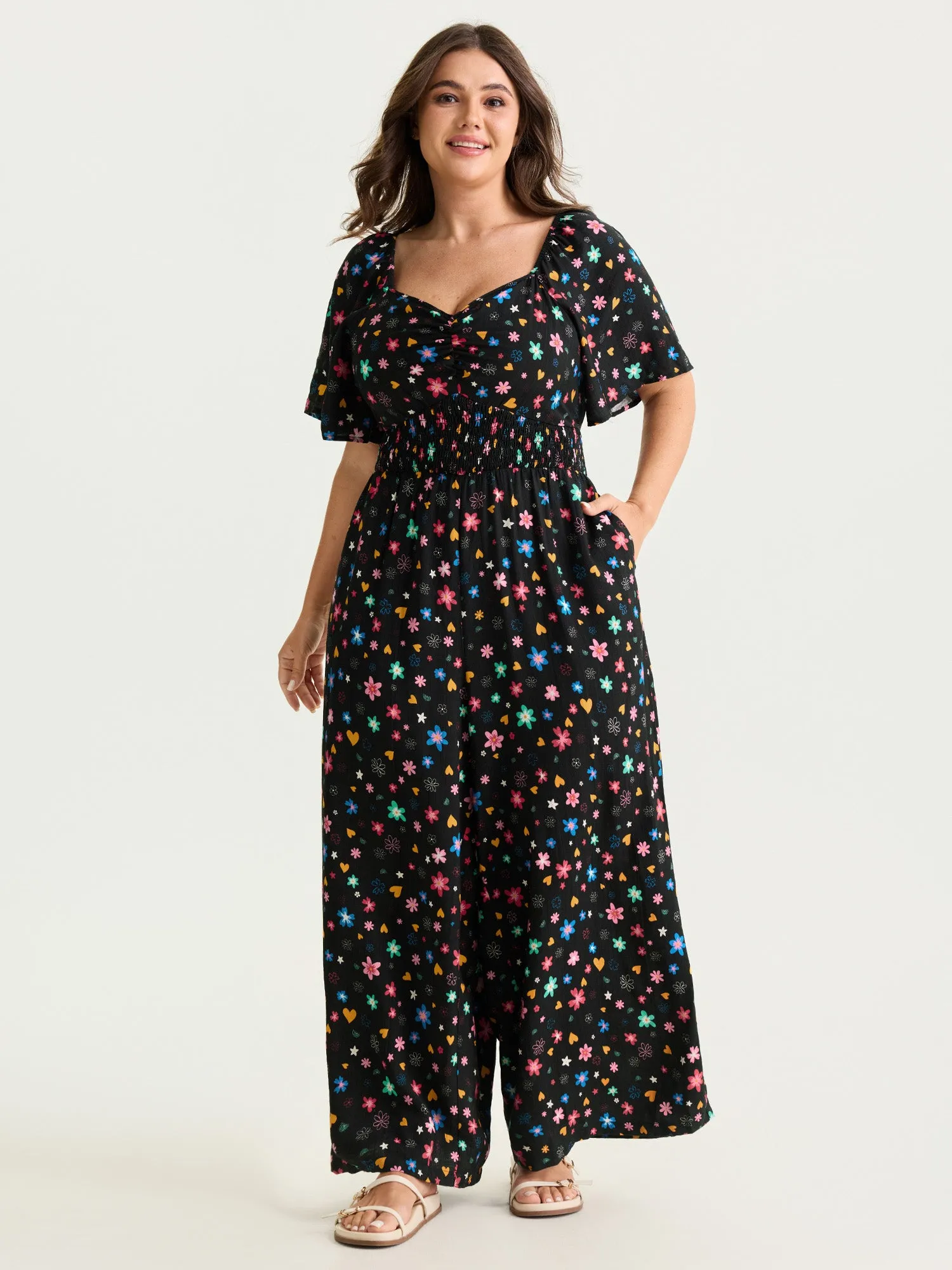 Colorful Floral Heart Print Cinched-Waist Jumpsuit sold by Bloomchic