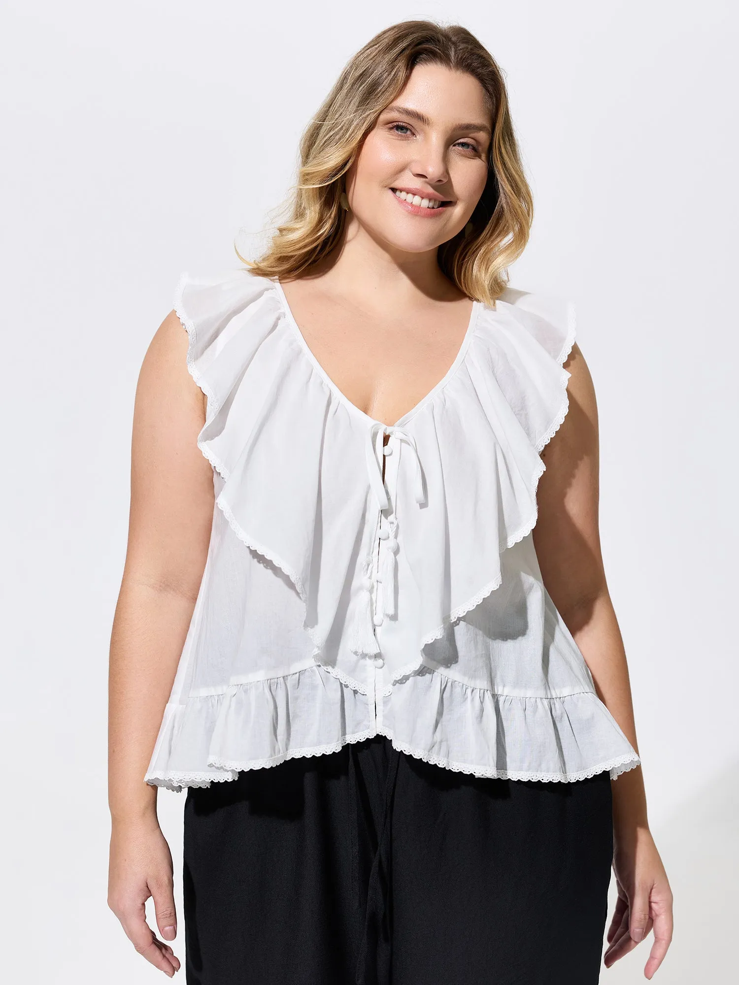 Cotton Ruffled Edges Tassel Plain Blouse sold by Bloomchic