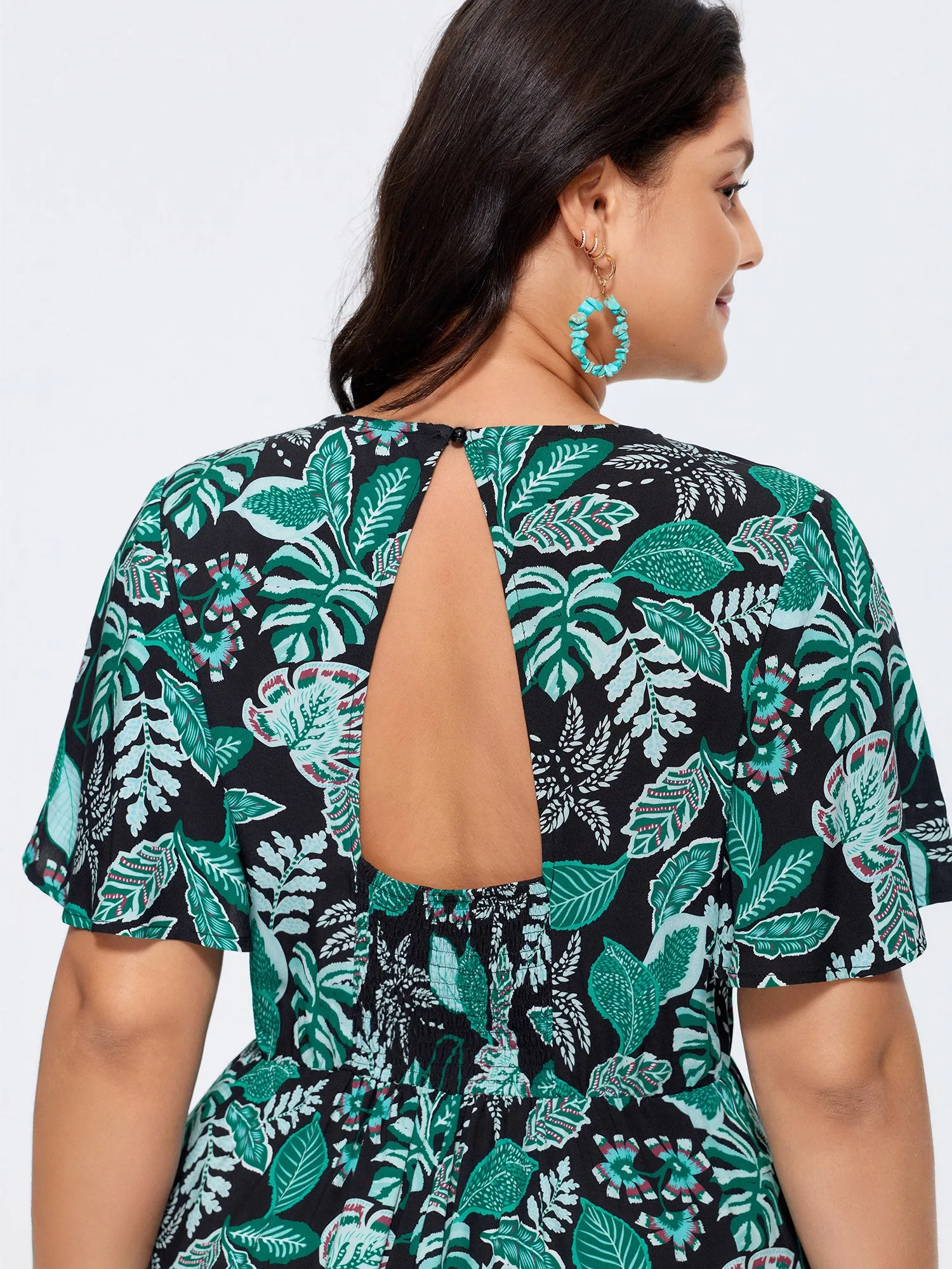 Tropical Print Cut-Out Back Romper sold by Bloomchic