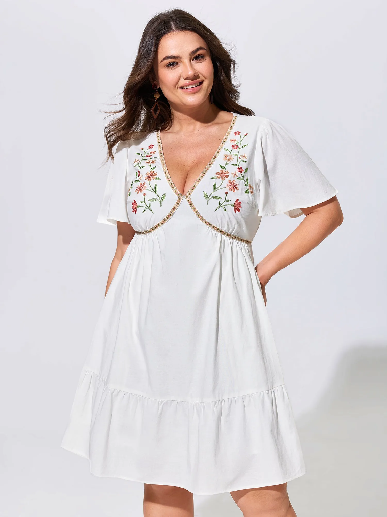 Floral Embroidered V-Neck Ruffled Hem Mini Dress sold by Bloomchic