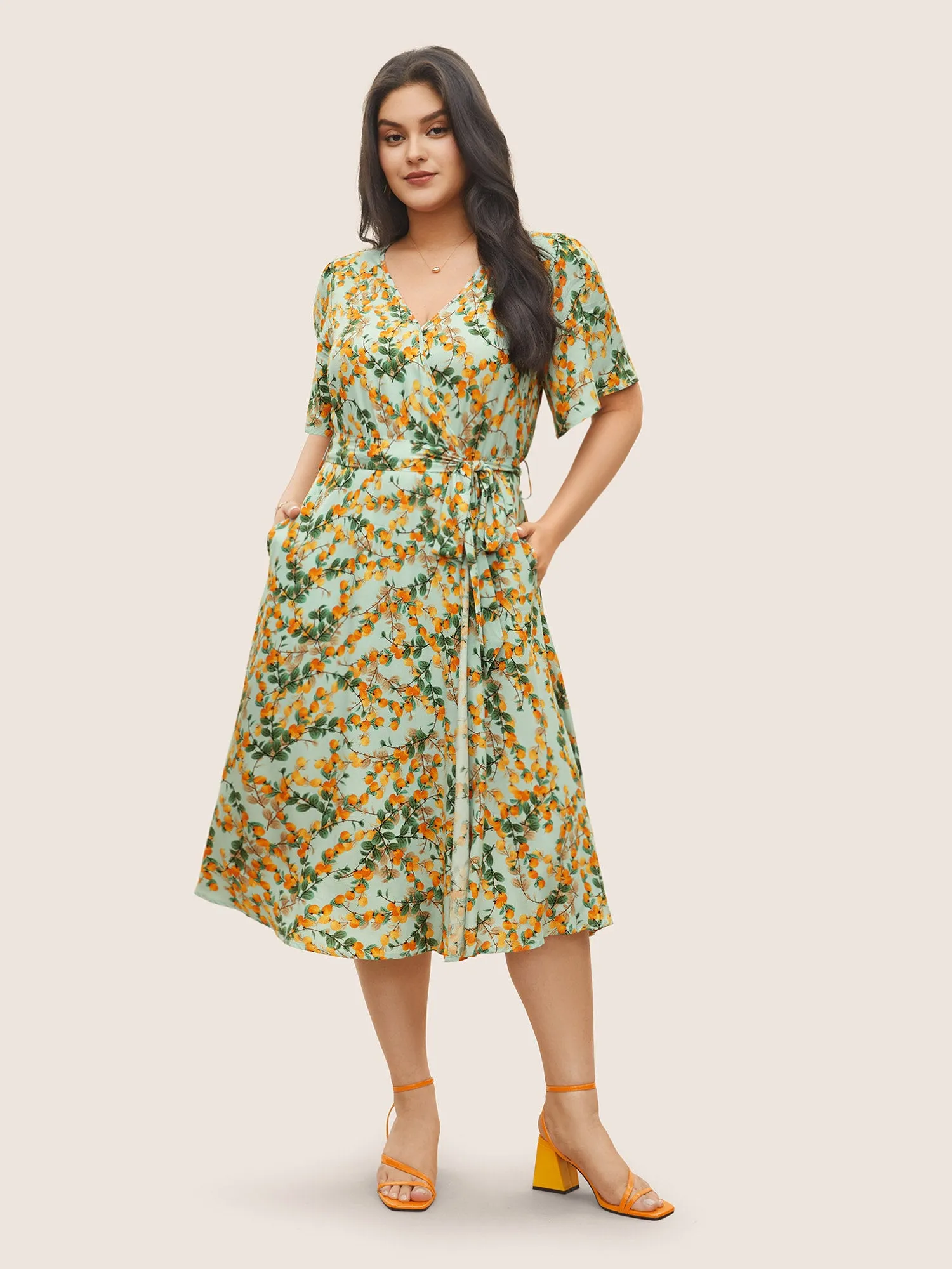 Citrus Fruit Print Belted Flutter Sleeve Wrap Dress sold by Bloomchic