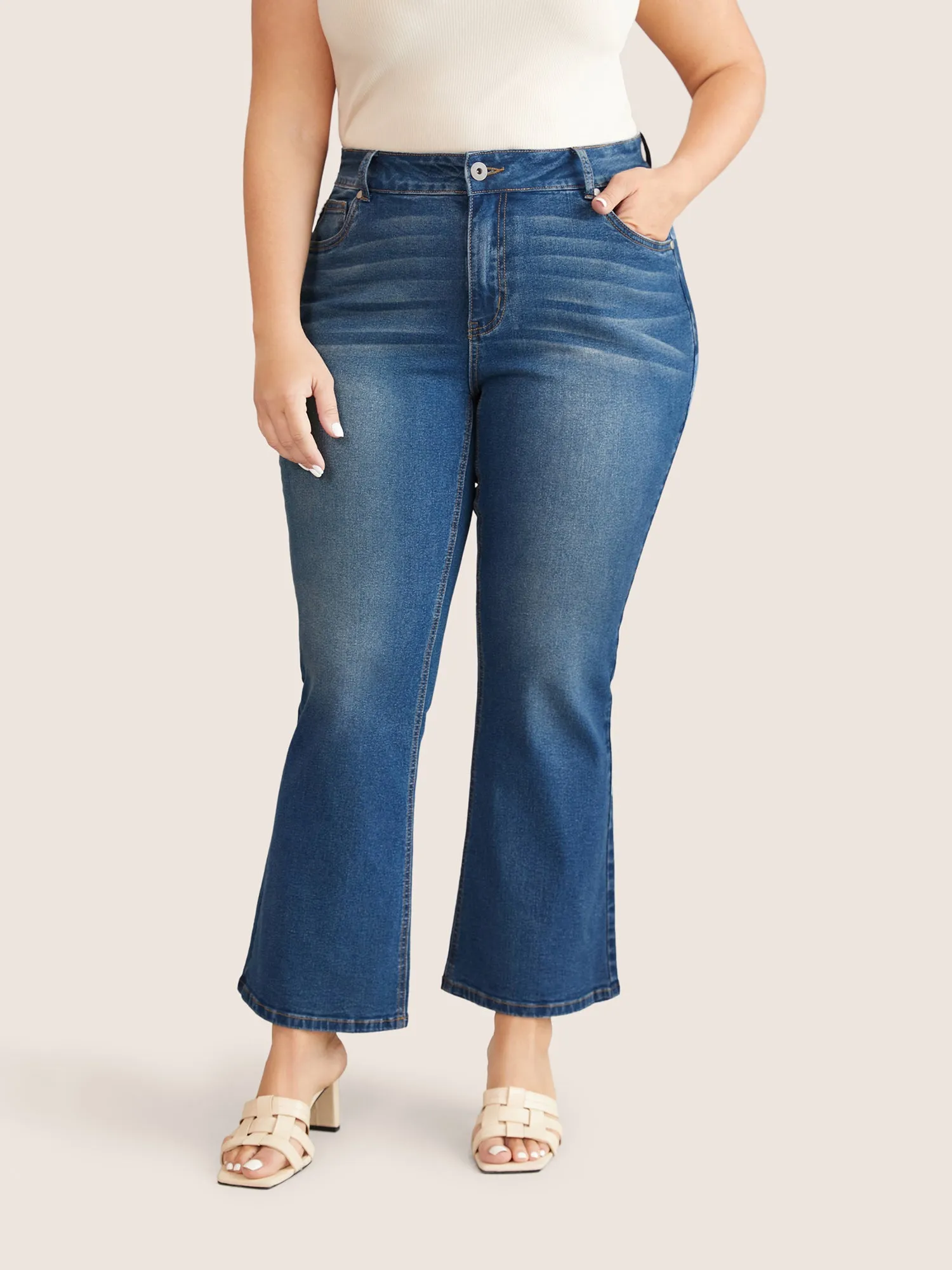 Medium Wash Flare Leg High Jeans sold by Bloomchic