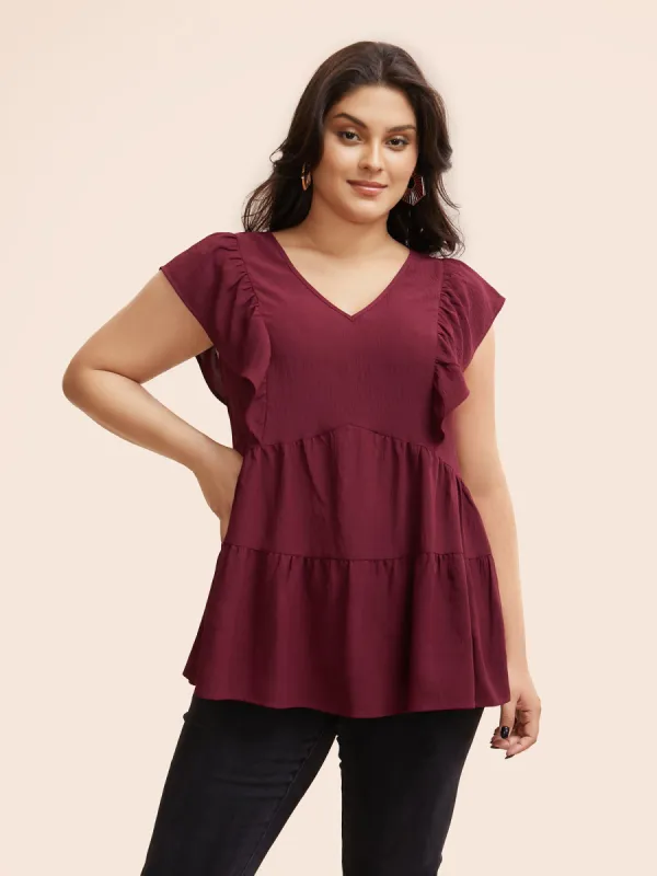 Solid Layered Hem Ruffle Cap Sleeve Blouse sold by Bloomchic