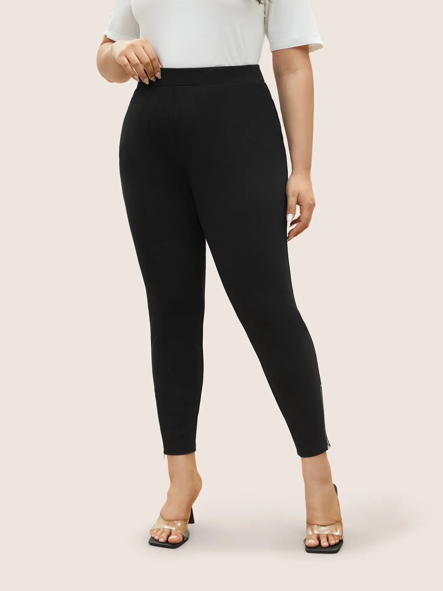 Solid High Rise Zipper Hem Leggings sold by Bloomchic