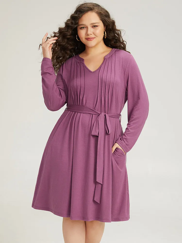 Solid Notched Pocket Pleated Belted Dress sold by Bloomchic