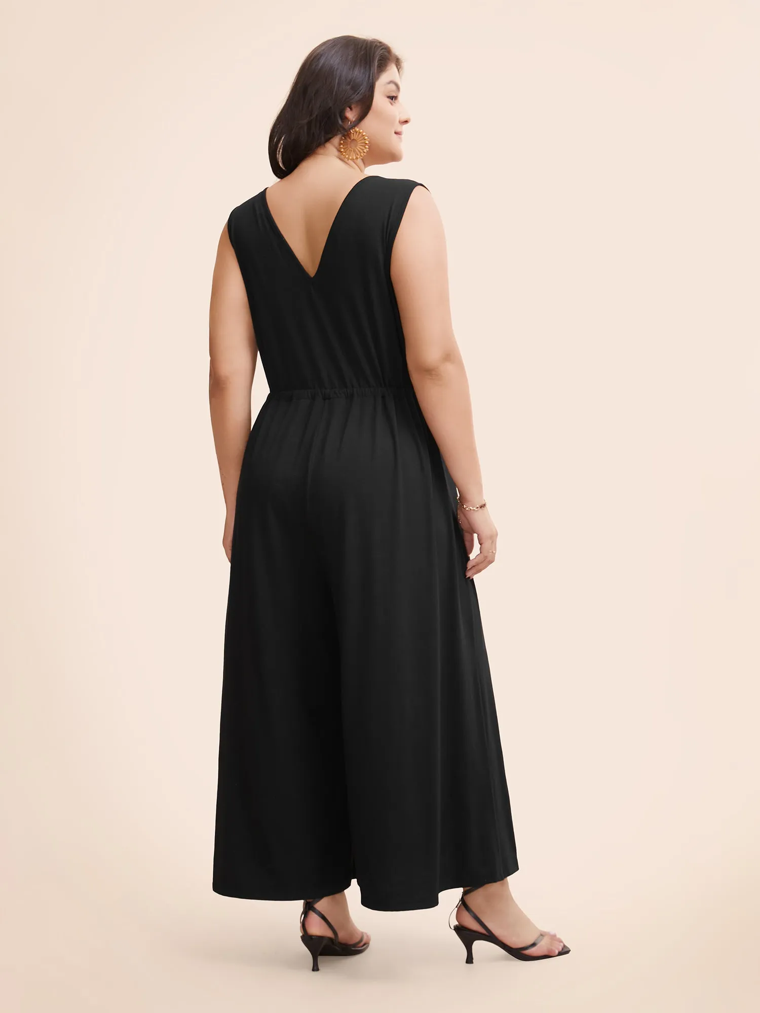 Solid Overlap Collar Drawstring Jumpsuit sold by Bloomchic