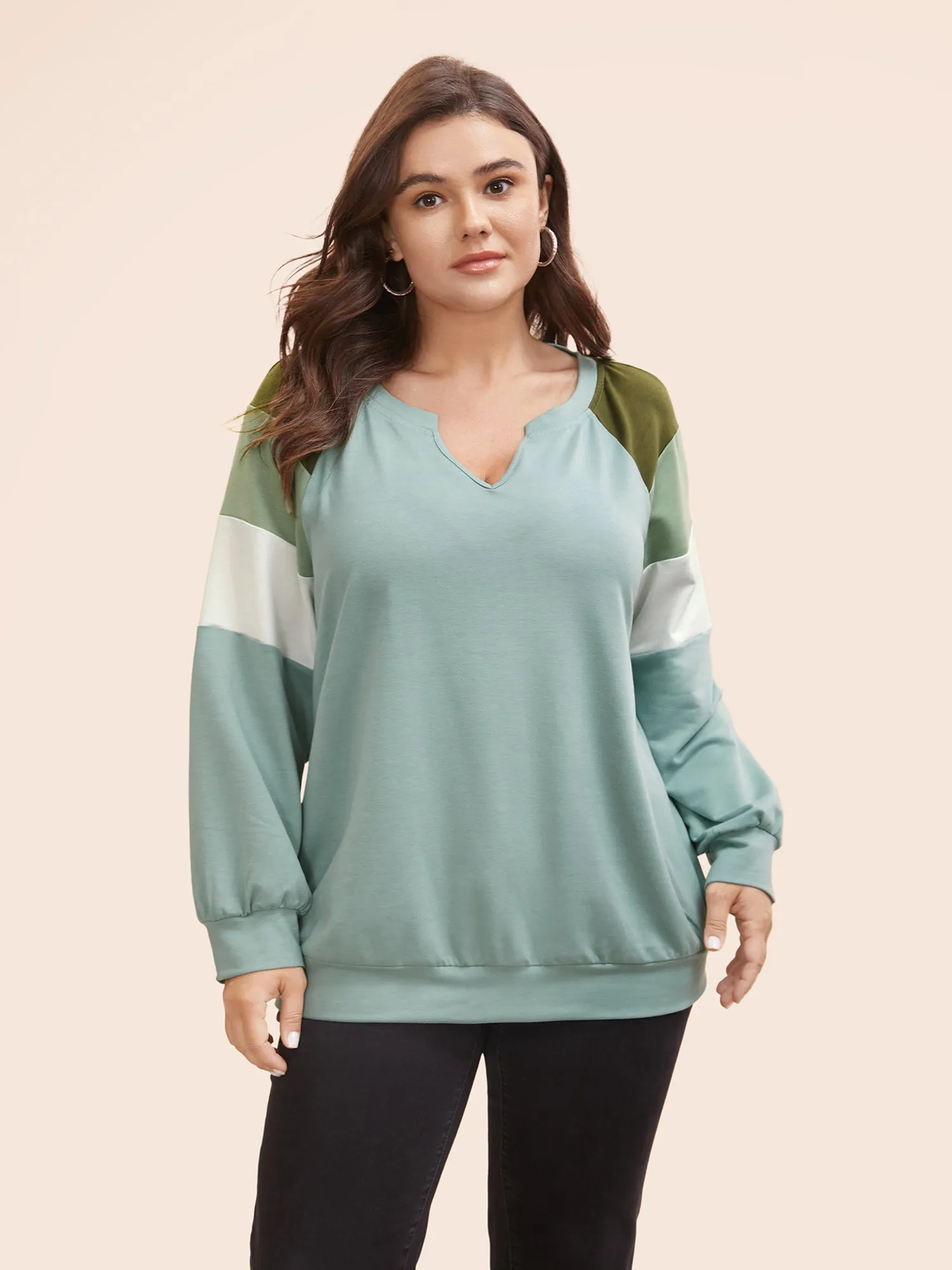 Contrast Patchwork Notched Raglan Sleeve Sweatshirt sold by Bloomchic