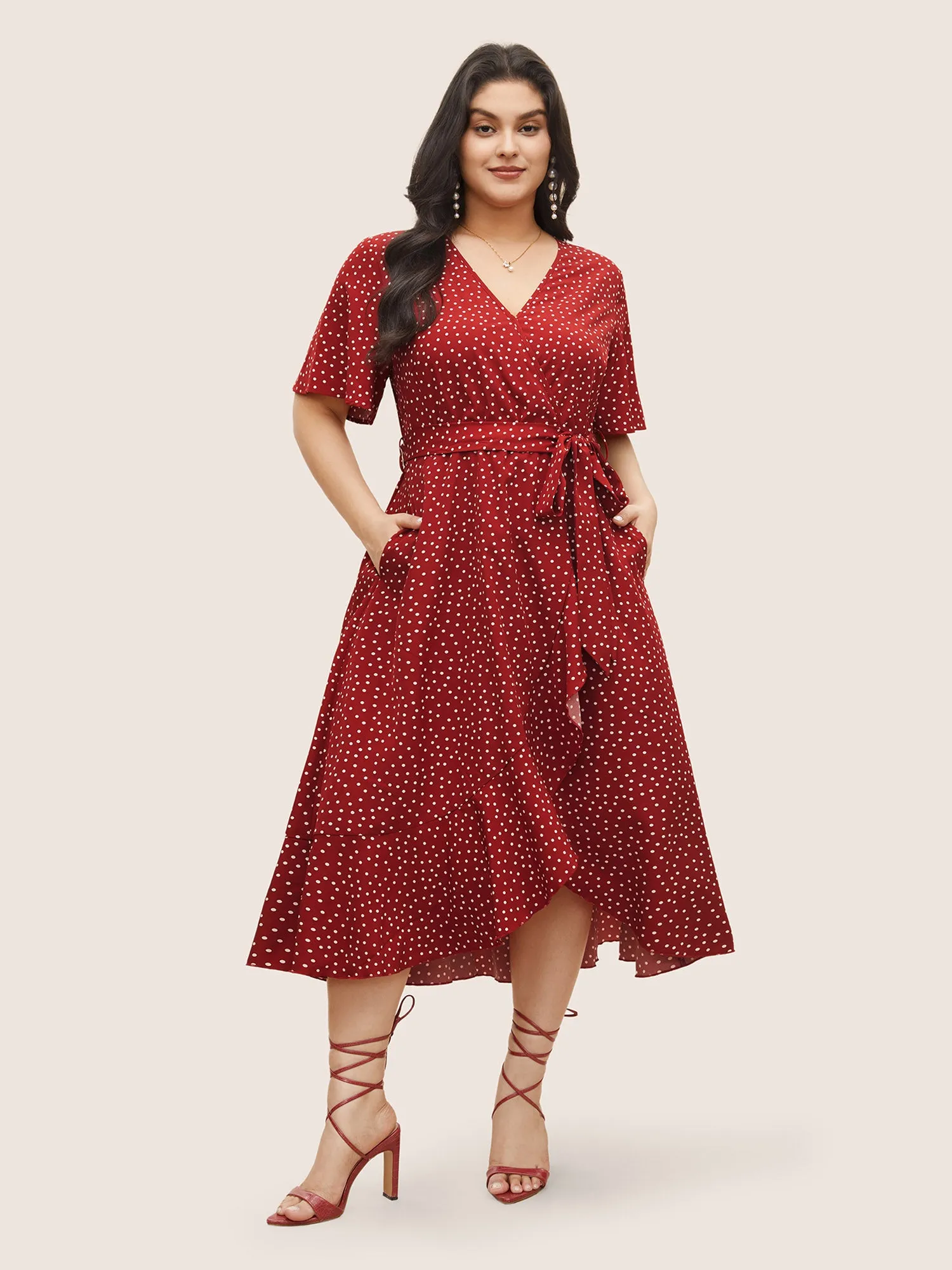 Polka Dot Surplice Neck Belted Arc Hem Dress sold by Bloomchic