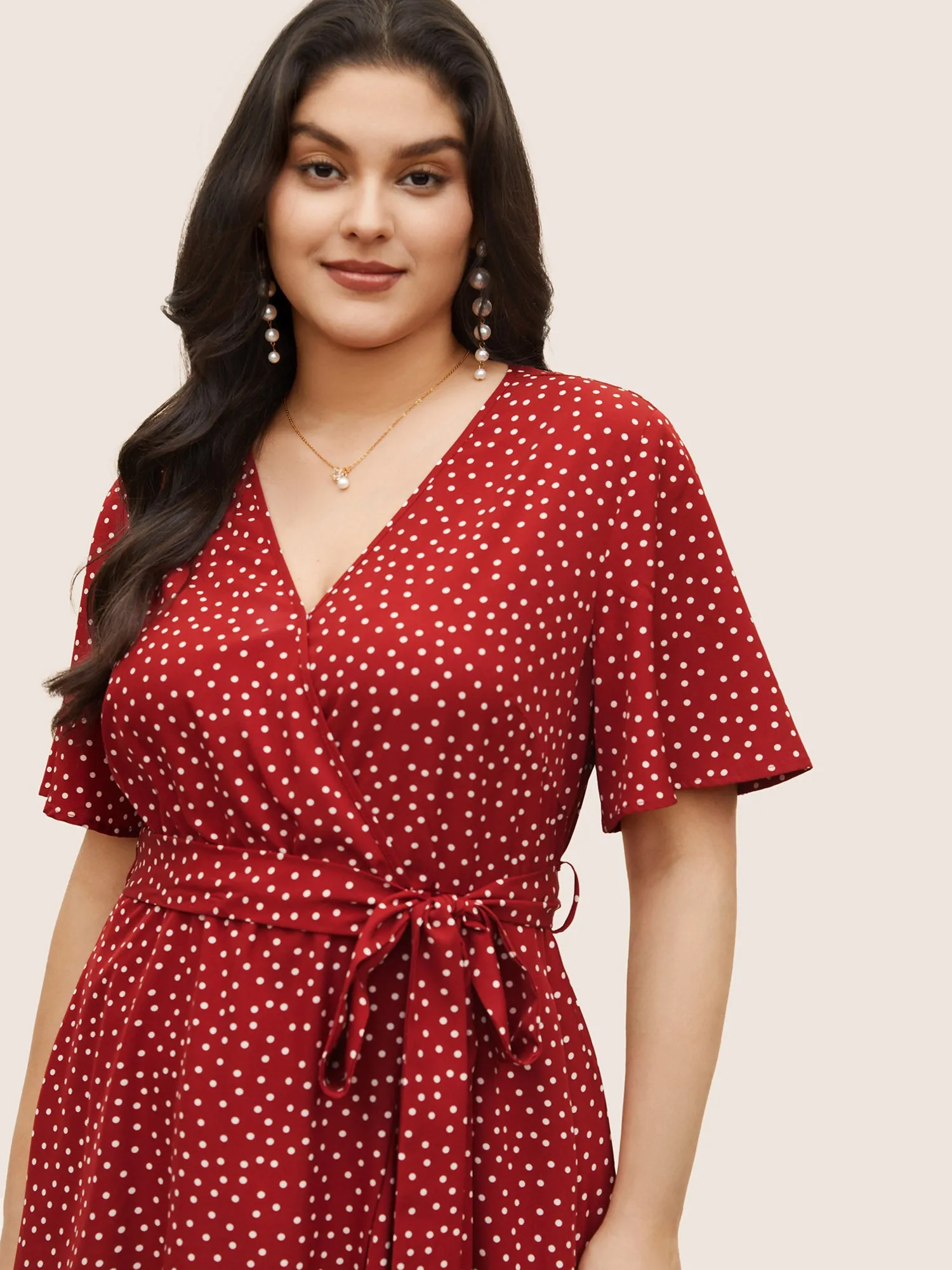 Polka Dot Surplice Neck Belted Arc Hem Dress sold by Bloomchic product image thumbnail 4