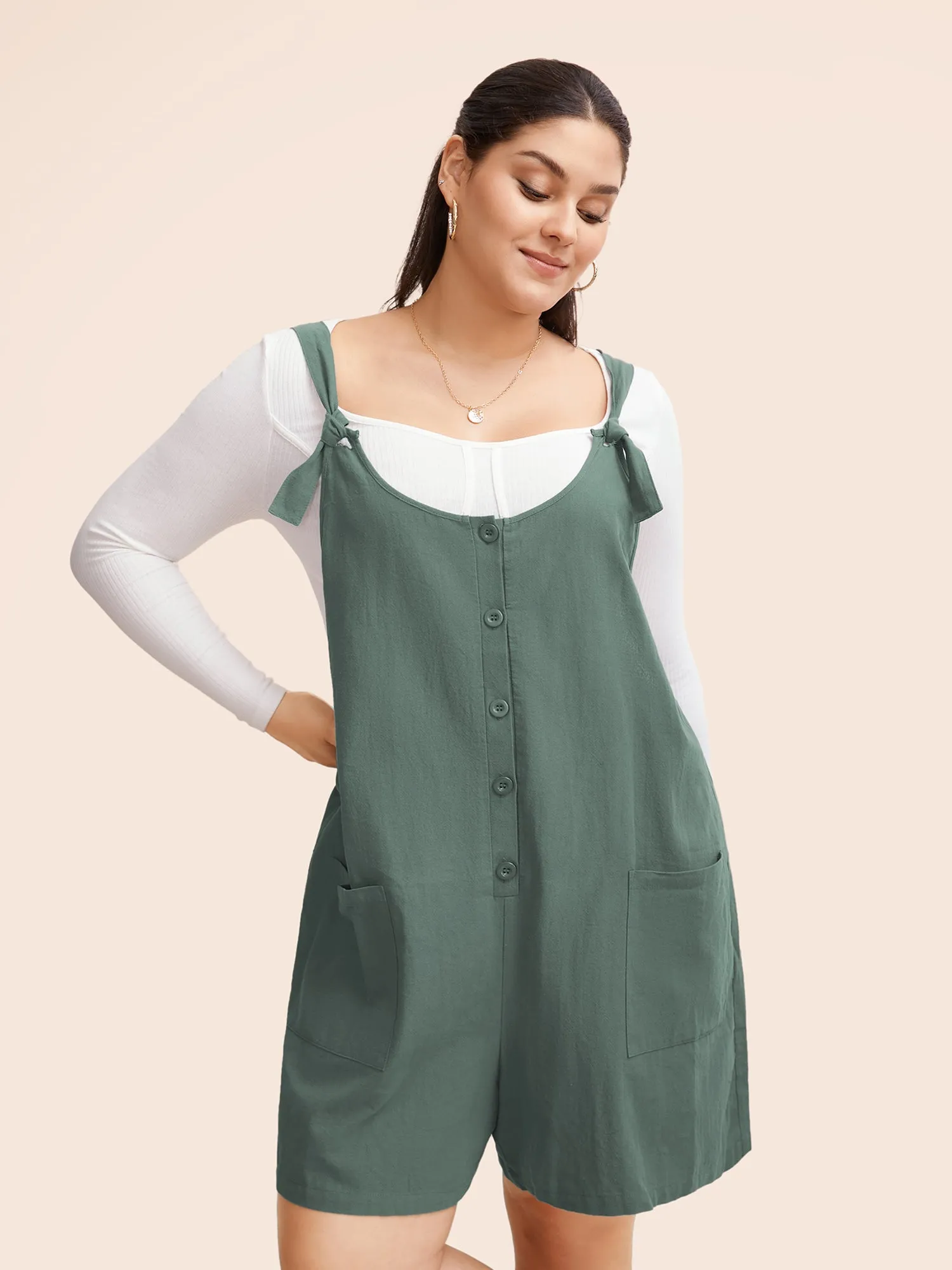 Solid Pocket Button Detail Knot Shoulder Overall Romper sold by Bloomchic