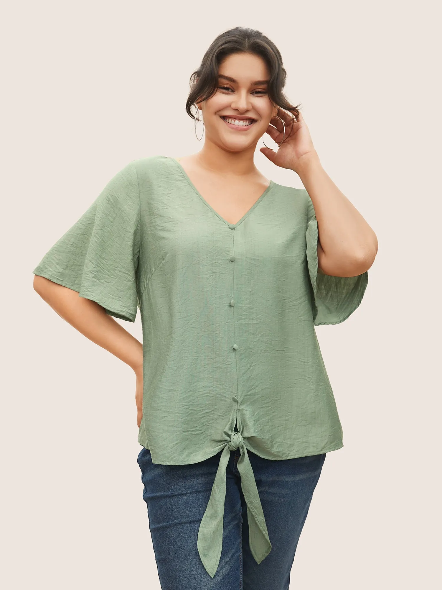 Solid Tie Knot Button Detail Ruffle Sleeve Blouse sold by Bloomchic