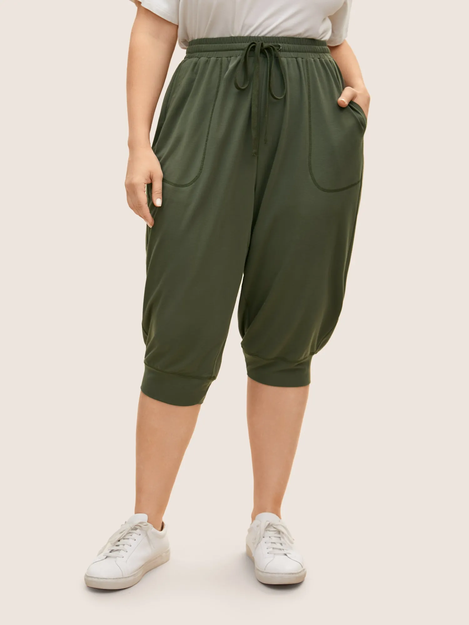 Solid Drawstring Topstitching Mid Rise Carrot Pants sold by Bloomchic