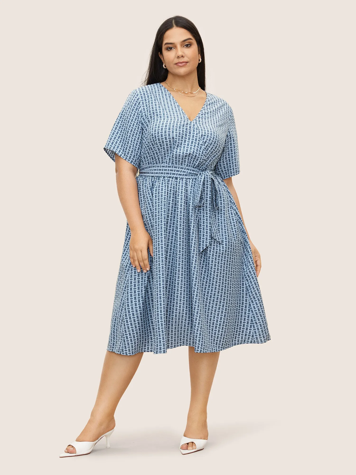 Geometric Overlap Collar Elastic Waist Belted Dress sold by Bloomchic