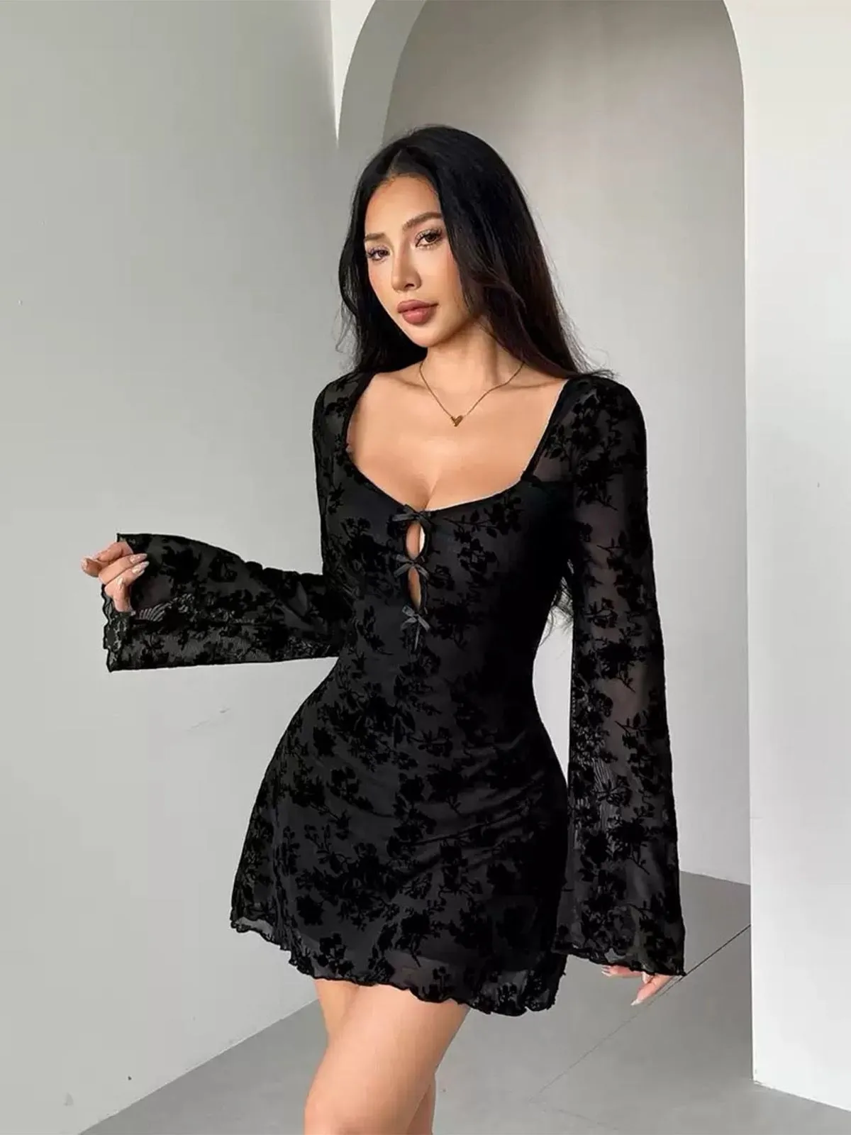 1980s Flocked Floral Cutout Bow Flare Dress sold by Retro Stage