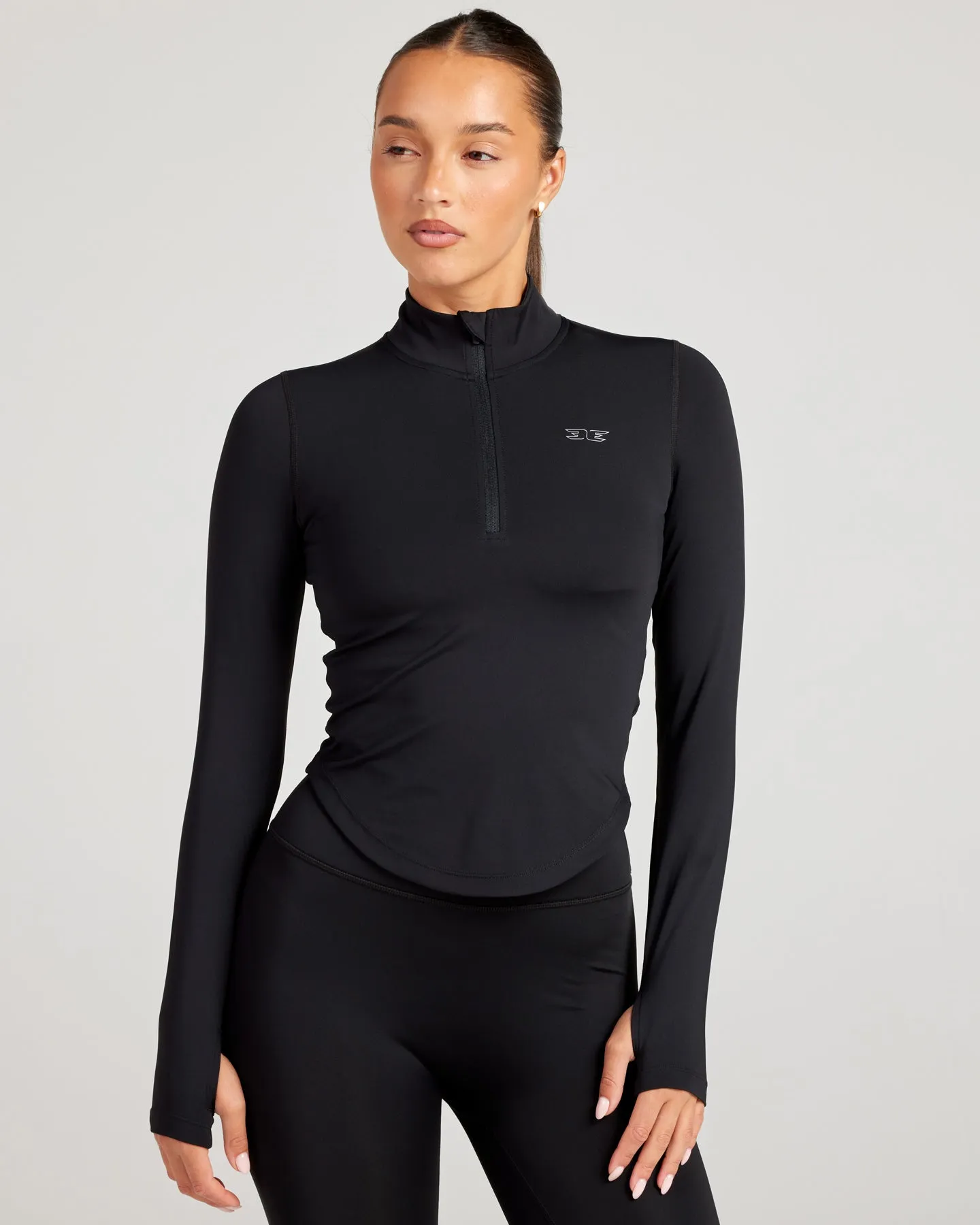 ProForm Curved 1/4 Zip - Black sold by Elite Eleven