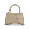 Hourglass XS Metallized Croco Embossed Bag in Light Gold sold by MARAIS