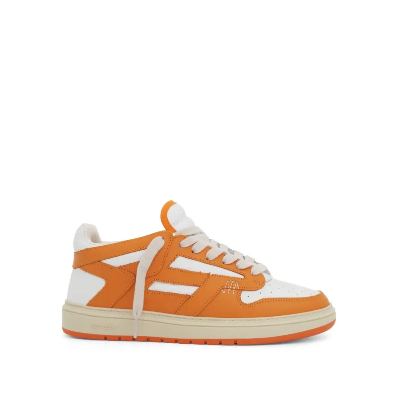 Reptor Low Sneaker in Neon Orange/Vintage White sold by MARAIS