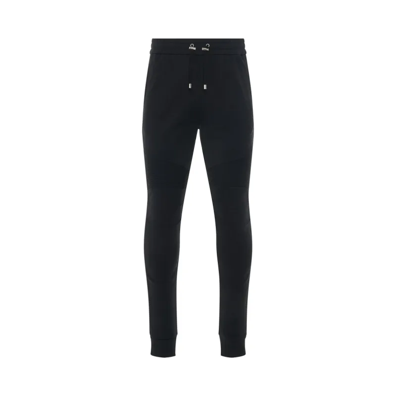 Logo Flock Sweatpants in Black sold by MARAIS