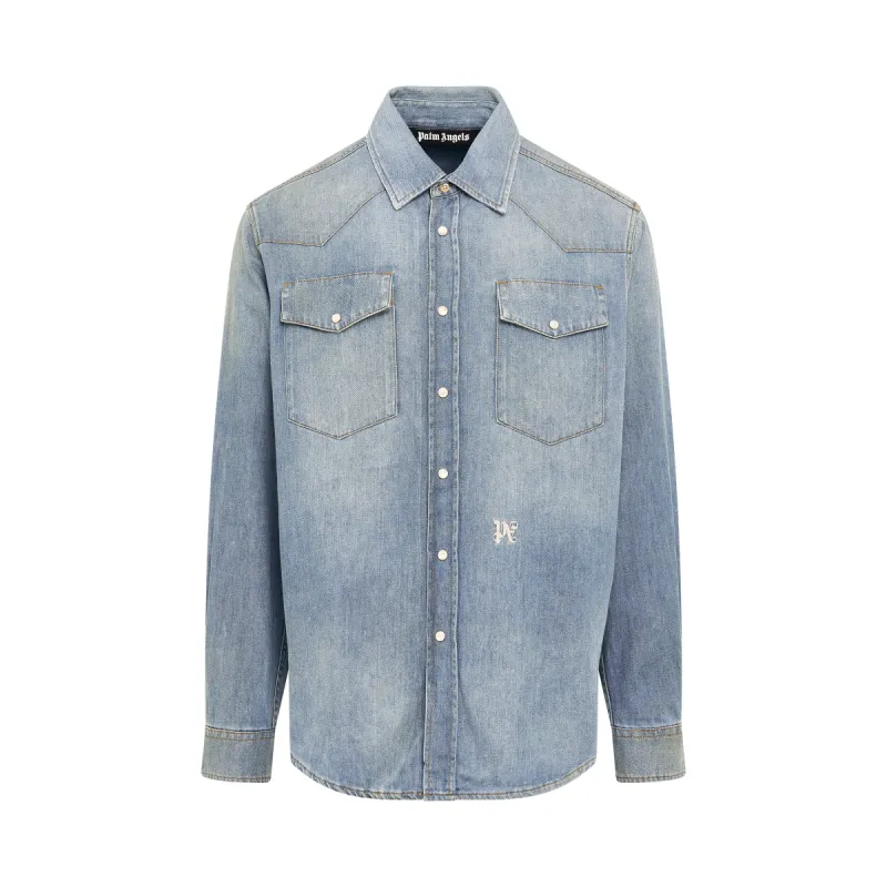 Monogram Embroidered Denim Shirt in Light Blue sold by MARAIS