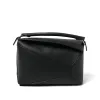 Puzzle Edge Bag in Black sold by MARAIS
